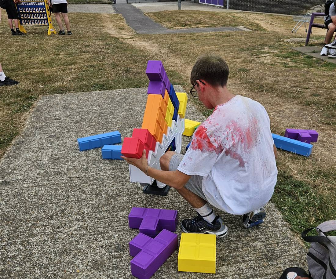 A student lining up a piece on Tetris Tumble XL in the playground